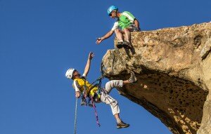 Climbing team struggles to the summit.